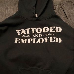 Tattoo and employed hoodie